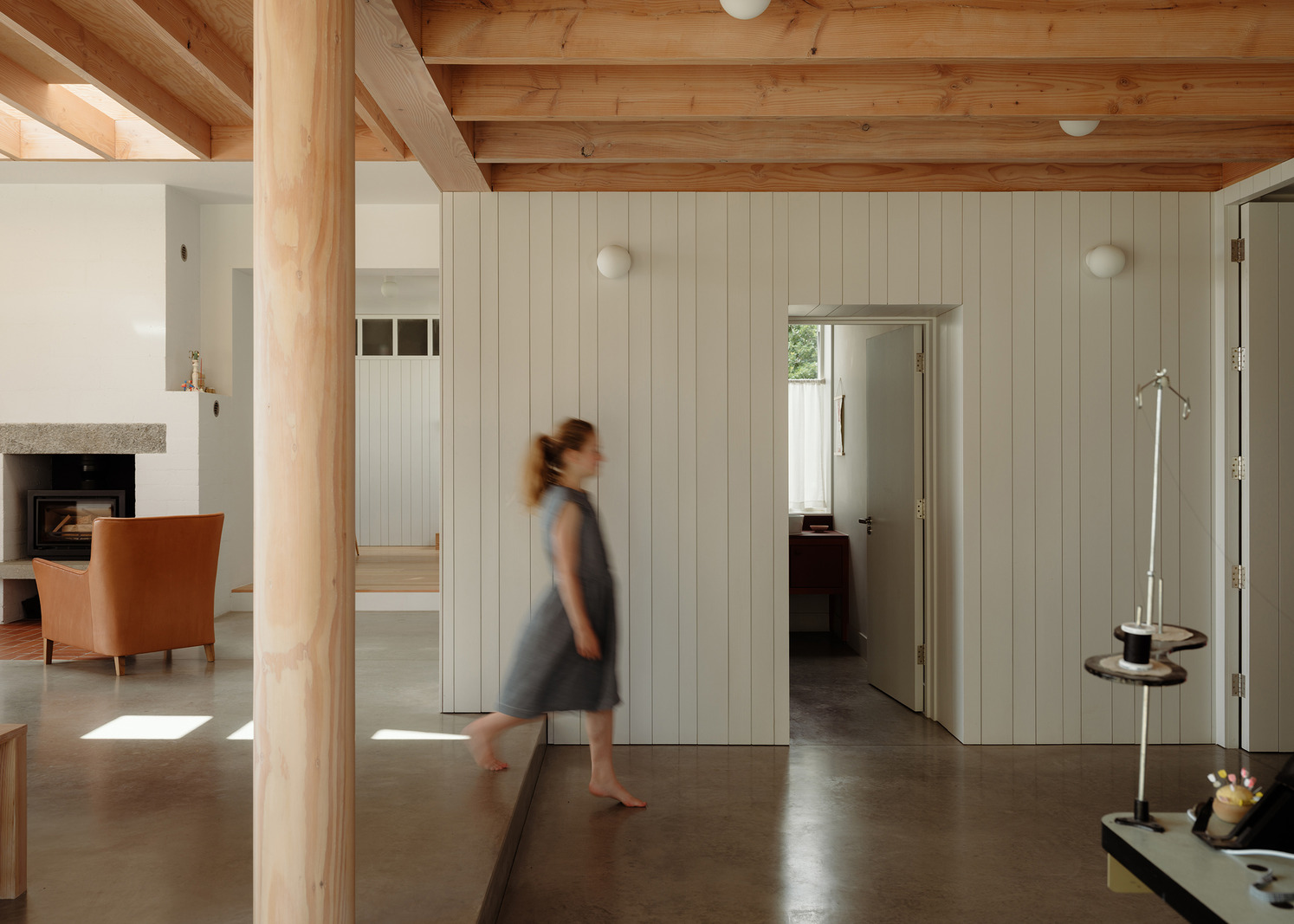Hearth and horizon: bringing cohesion and flow to a mid-century ‘lair’ with a thrilling past